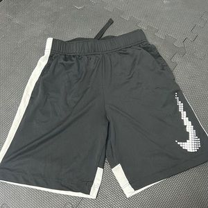Black Nike shorts.